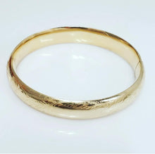 Load image into Gallery viewer, 14k Yellow Gold Hard Oval Bangle Bracelet 10.8mm 6 3/4&quot; (small dent)
