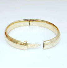 Load image into Gallery viewer, 14k Yellow Gold Hard Oval Bangle Bracelet 10.8mm 6 3/4&quot; (small dent)
