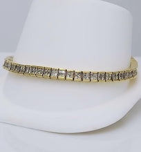 Load image into Gallery viewer, 5 CT. T.W. PRINCESS CUT DIAMOND TENNIS BRACELET in 14K YELLOW GOLD 4.9mm 7&quot;
