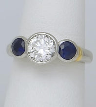 Load image into Gallery viewer, PLATINUM 750 1.17ct DIAMOND .50ct SAPPHIRE THREE STONE BEZEL SET ENGAGEMENT RING
