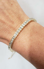 Load image into Gallery viewer, 5 CT. T.W. PRINCESS CUT DIAMOND TENNIS BRACELET in 14K YELLOW GOLD 4.9mm 7&quot;
